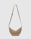 Internal Features	2 Slip Pockets
Internal Lining	Polyester Recycled Black and White Stripe 100% Lining
Crossbody Strap	Adjustable and Non-Detachable 34-65cm Vegan Leather Strap
Closure	Secure Zip
Body Material	Polyurethane Vegan Leather 100%
Hardware	Light Gold
Dimensions	W29 x H15.5 x D10cm
Weight	0.3kg