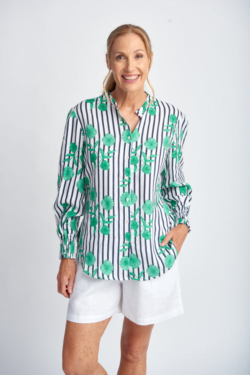 A classic button through shirt in a fresh and striking floral and stripe print. Wear the full length sleeve as is or use the tab to roll for a three quarter option. Slightly scooped sides give a flattering line if worn out but it is also not too full to be worn tucked.

100% linen