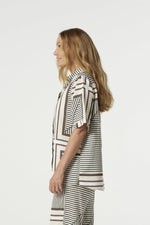 The Ember Linen Cotton Shirt in the large square print is crafted from a breathable blend of 55% linen and 45% cotton. Designed in a loose fit with stitched cuffs, side splits and a straight hem, it’s part of the Riverlight collection, with the bold check inspired by the paddocks and fence lines of Goondiwindi.

55% Linen 45% Cotton
Loose fit
Side splits
Straight hem
Stitched cuff