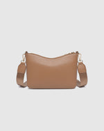 The Louenhide Linda Caramel Crossbody Bag is the new everyday staple. A classic silhouette meets modern design, this small crossbody bag is a little dressier than your typical everyday style. Wear her crossbody by day or change the straps to use as a shoulder bag by night. Stylish, practical and spacious enough to fit your essentials and more, this multiwear bag is as practical as she is versatile. Elevate your everyday with the Linda Caramel Crossbody Bag by your side.