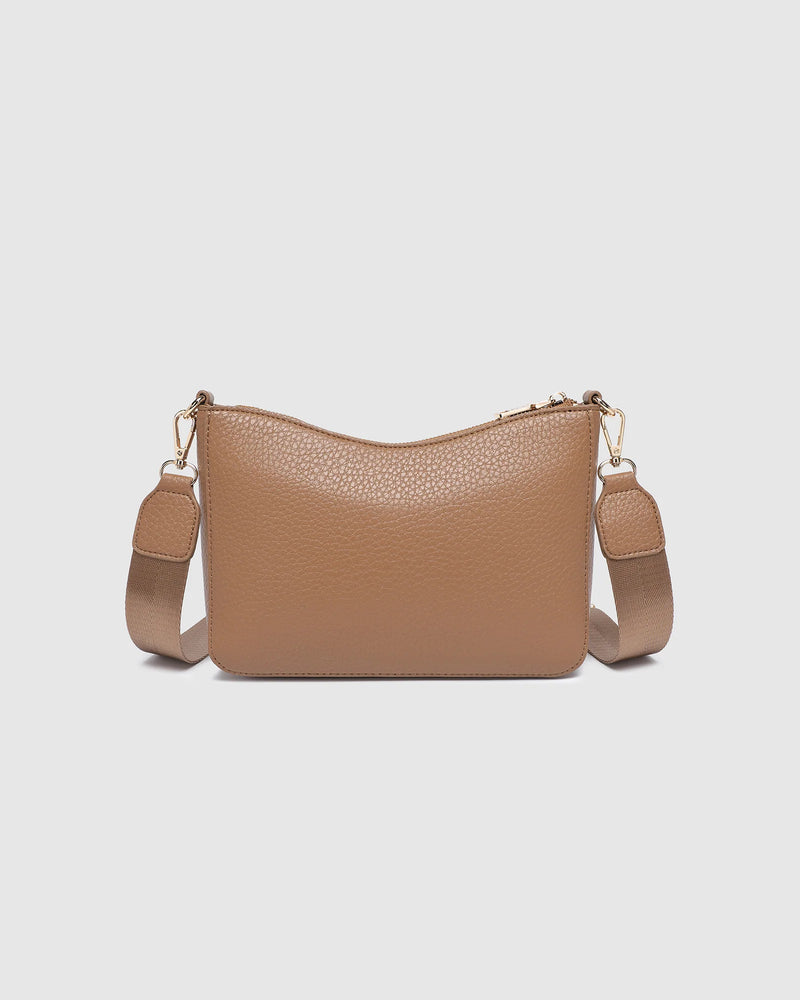 The Louenhide Linda Caramel Crossbody Bag is the new everyday staple. A classic silhouette meets modern design, this small crossbody bag is a little dressier than your typical everyday style. Wear her crossbody by day or change the straps to use as a shoulder bag by night. Stylish, practical and spacious enough to fit your essentials and more, this multiwear bag is as practical as she is versatile. Elevate your everyday with the Linda Caramel Crossbody Bag by your side.