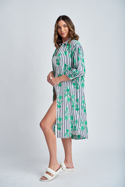 This shirtmaker dress in a summery green print with a navy stripe in the background can also be worn as an overshirt making it a very versatile piece in your summer wardrobe.