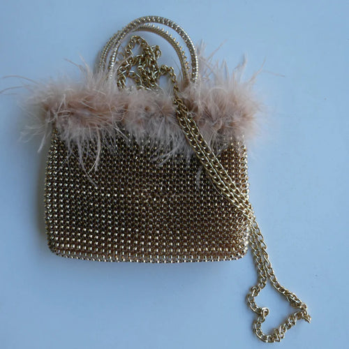 18.5 x 17 x 2cm
Top Handles (9cm)
Hand Woven PVC with Rabbit Fur Trim
Removable Chain Strap
Made in China