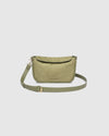 The Louenhide Saylor Sage Green Crossbody Bag brings a bold yet refined edge to your everyday styling. With its soft faux suede finish and sleek baguette-shaped silhouette, this cross body bag with chain detailing blends texture and refinement in all the right ways. Designed to be worn with ease but styled to stand out, the Saylor Sage Green moves effortlessly from day to night, adding impact to your layered winter looks. Wherever the day leads, this chain strap handbag is the finishing touch that completes