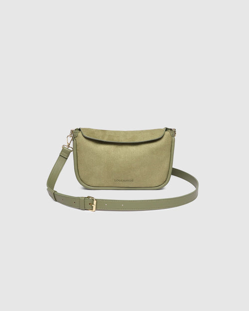 The Louenhide Saylor Sage Green Crossbody Bag brings a bold yet refined edge to your everyday styling. With its soft faux suede finish and sleek baguette-shaped silhouette, this cross body bag with chain detailing blends texture and refinement in all the right ways. Designed to be worn with ease but styled to stand out, the Saylor Sage Green moves effortlessly from day to night, adding impact to your layered winter looks. Wherever the day leads, this chain strap handbag is the finishing touch that completes