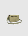 The Louenhide Saylor Sage Green Crossbody Bag brings a bold yet refined edge to your everyday styling. With its soft faux suede finish and sleek baguette-shaped silhouette, this cross body bag with chain detailing blends texture and refinement in all the right ways. Designed to be worn with ease but styled to stand out, the Saylor Sage Green moves effortlessly from day to night, adding impact to your layered winter looks. Wherever the day leads, this chain strap handbag is the finishing touch that completes