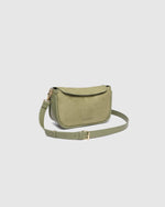 The Louenhide Saylor Sage Green Crossbody Bag brings a bold yet refined edge to your everyday styling. With its soft faux suede finish and sleek baguette-shaped silhouette, this cross body bag with chain detailing blends texture and refinement in all the right ways. Designed to be worn with ease but styled to stand out, the Saylor Sage Green moves effortlessly from day to night, adding impact to your layered winter looks. Wherever the day leads, this chain strap handbag is the finishing touch that completes