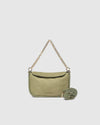 The Louenhide Saylor Sage Green Crossbody Bag brings a bold yet refined edge to your everyday styling. With its soft faux suede finish and sleek baguette-shaped silhouette, this cross body bag with chain detailing blends texture and refinement in all the right ways. Designed to be worn with ease but styled to stand out, the Saylor Sage Green moves effortlessly from day to night, adding impact to your layered winter looks. Wherever the day leads, this chain strap handbag is the finishing touch that completes