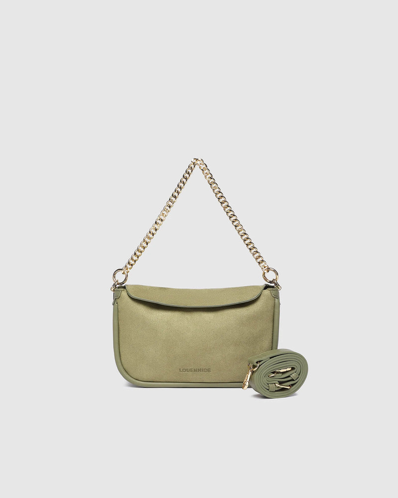 The Louenhide Saylor Sage Green Crossbody Bag brings a bold yet refined edge to your everyday styling. With its soft faux suede finish and sleek baguette-shaped silhouette, this cross body bag with chain detailing blends texture and refinement in all the right ways. Designed to be worn with ease but styled to stand out, the Saylor Sage Green moves effortlessly from day to night, adding impact to your layered winter looks. Wherever the day leads, this chain strap handbag is the finishing touch that completes