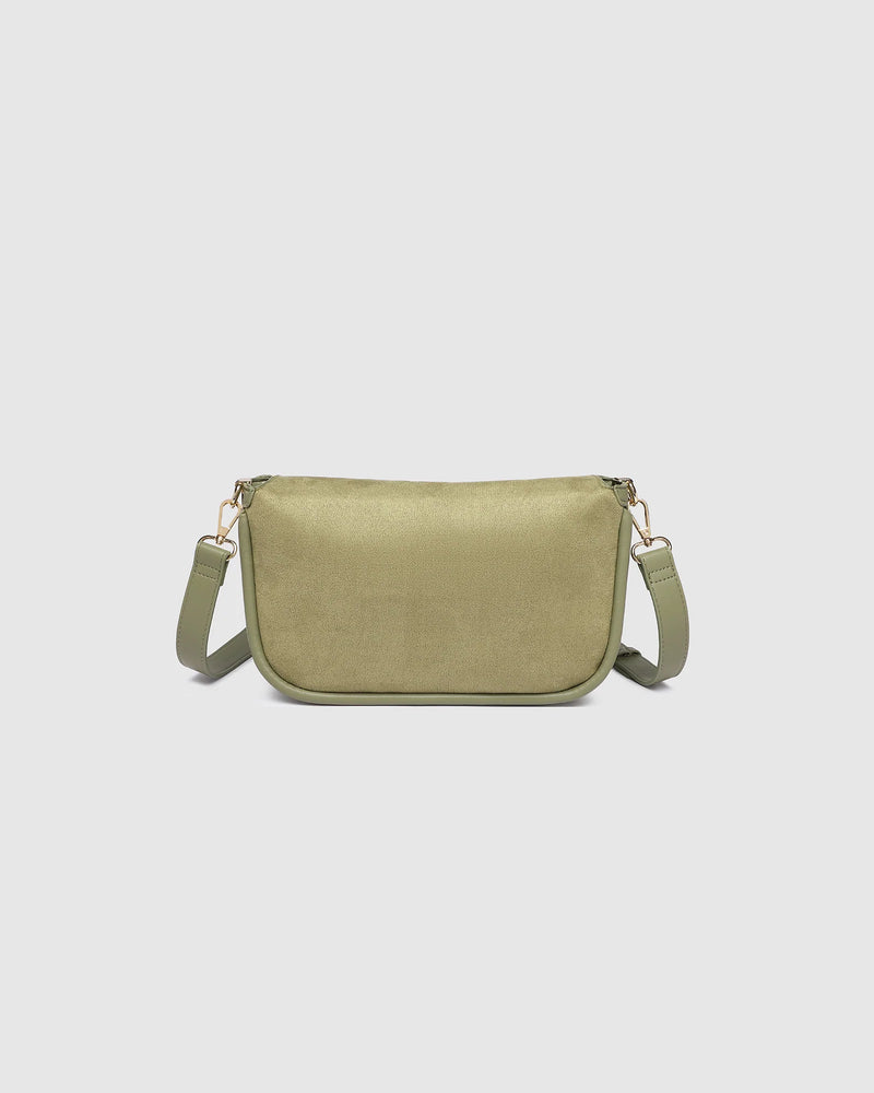 The Louenhide Saylor Sage Green Crossbody Bag brings a bold yet refined edge to your everyday styling. With its soft faux suede finish and sleek baguette-shaped silhouette, this cross body bag with chain detailing blends texture and refinement in all the right ways. Designed to be worn with ease but styled to stand out, the Saylor Sage Green moves effortlessly from day to night, adding impact to your layered winter looks. Wherever the day leads, this chain strap handbag is the finishing touch that completes