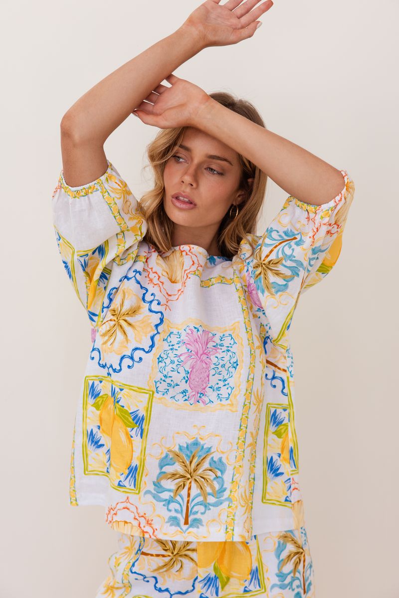 100% linen in the fresh Amalfi Print of lemons and blues is in this sweet little top with it's elbow length sleeve.