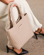 Internal Features	Base Plate
Handle Height	14cm and Falls Flat on Body
PU Strap	Adjustable and Detachable 99-114cm PU Strap
Closure	Magnetic Clasp
Body Material	Polyurethane Vegan Leather 100%
Hardware	Light Gold
Dimensions	W21 x H20 x D8cm
Weight	0.55kg