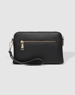 The Louenhide Poppy Clutch strikes the perfect balance between minimalism, versatility and style. She's the ideal addition to your tote as a sleek clutch wallet or the perfect grab-and-go companion when carried by the wristlet. Created with soft vegan leather with a compact design, your essentials are organised in the backside pocket while held safe with the secure zip closures. Never go without your essentials and easily adapt to every occasion with the Poppy Clutch.
