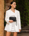 The Louenhide Poppy Clutch strikes the perfect balance between minimalism, versatility and style. She's the ideal addition to your tote as a sleek clutch wallet or the perfect grab-and-go companion when carried by the wristlet. Created with soft vegan leather with a compact design, your essentials are organised in the backside pocket while held safe with the secure zip closures. Never go without your essentials and easily adapt to every occasion with the Poppy Clutch.