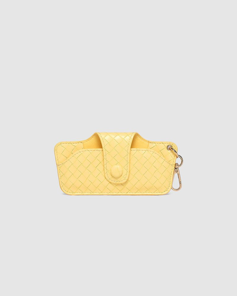 The Louenhide Skittle Sunglass Case is the perfect blend of style and functionality for your everyday eyewear. For ultimate convenience, effortlessly attach to your keys or handbag with the light gold hardware keyring clasp. Without compromising on style, the exterior features a gorgeous vegan leather, while the interior is lined with soft suede material to keep your everyday eyewear protected. Whether it's your favourite sunglasses or your reading glasses, they will stay protected and safe with the secure 