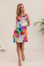 This square necked, sleeveless little shift dress in 100% linen and this vivid patterned fabric is bound to be a favourite in the summer months.