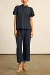 Crafted in 100% cotton poplin, the Harbour pant is elevated with custom ladder-lace embroidery that flows into a scalloped cropped hem. A neat, flat waistband creates a clean and tailored fit, balancing femininity with structure. Designed for versatility, it pairs seamlessly with the pier top for a French-inspired set that feels timeless and modern.

100% cotton poplin
custom ladder-lace embroidery
scalloped cropped hem for refined finish
neat-fitting, flat waistband for structure
pairs perfectly with the p