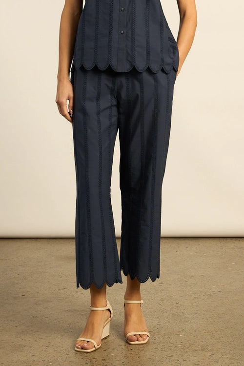 Crafted in 100% cotton poplin, the Harbour pant is elevated with custom ladder-lace embroidery that flows into a scalloped cropped hem. A neat, flat waistband creates a clean and tailored fit, balancing femininity with structure. Designed for versatility, it pairs seamlessly with the pier top for a French-inspired set that feels timeless and modern.

100% cotton poplin
custom ladder-lace embroidery
scalloped cropped hem for refined finish
neat-fitting, flat waistband for structure
pairs perfectly with the p