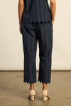 Crafted in 100% cotton poplin, the Harbour pant is elevated with custom ladder-lace embroidery that flows into a scalloped cropped hem. A neat, flat waistband creates a clean and tailored fit, balancing femininity with structure. Designed for versatility, it pairs seamlessly with the pier top for a French-inspired set that feels timeless and modern.

100% cotton poplin
custom ladder-lace embroidery
scalloped cropped hem for refined finish
neat-fitting, flat waistband for structure
pairs perfectly with the p
