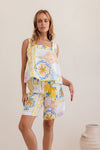 Matching shorts for your summer tops! 100% linen in the fresh Amalfi Dreams print in colours of lemon and blue, these mid length shorts have large front pockets, zip and button front, a flat band at the front and elastic at the back waist.