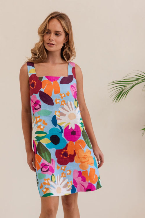 This square necked, sleeveless little shift dress in 100% linen and this vivid patterned fabric is bound to be a favourite in the summer months.