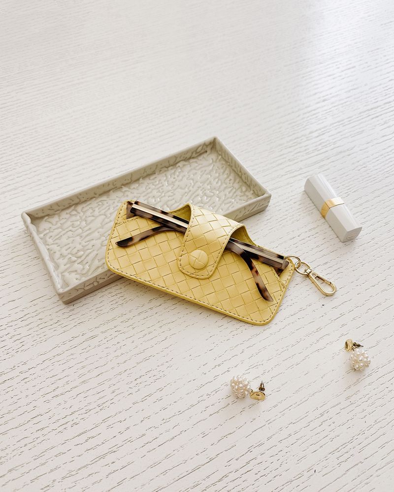 The Louenhide Skittle Sunglass Case is the perfect blend of style and functionality for your everyday eyewear. For ultimate convenience, effortlessly attach to your keys or handbag with the light gold hardware keyring clasp. Without compromising on style, the exterior features a gorgeous vegan leather, while the interior is lined with soft suede material to keep your everyday eyewear protected. Whether it's your favourite sunglasses or your reading glasses, they will stay protected and safe with the secure 