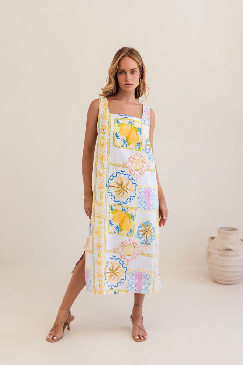 This mid length 100% linen dress has a square neckline, is sleeveless and in the fresh Amalfi Print of lemons and blues.