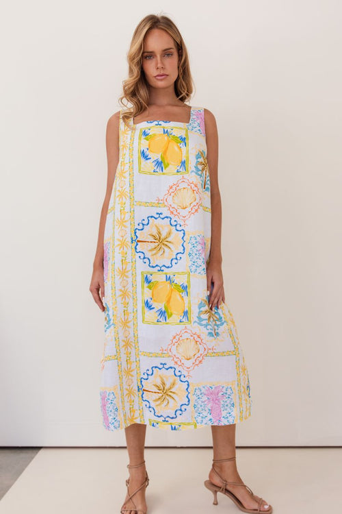 This mid length 100% linen dress has a square neckline, is sleeveless and in the fresh Amalfi Print of lemons and blues.