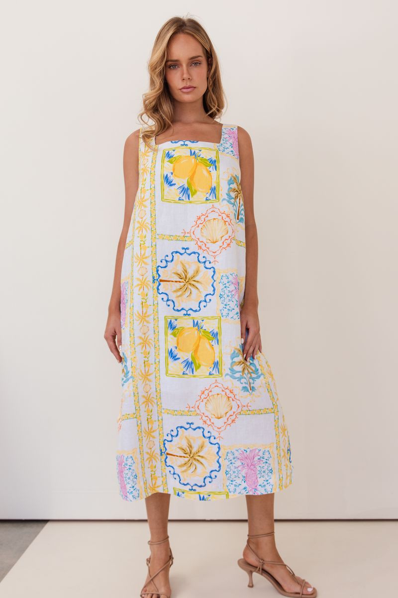 This mid length 100% linen dress has a square neckline, is sleeveless and in the fresh Amalfi Print of lemons and blues.