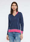 A light weight little jumper in cotton and cashmere from Zaket & Plover. Front and sleeves are a dark denim colour with the back being a lighter washed colour and trims of fuchsia pink.