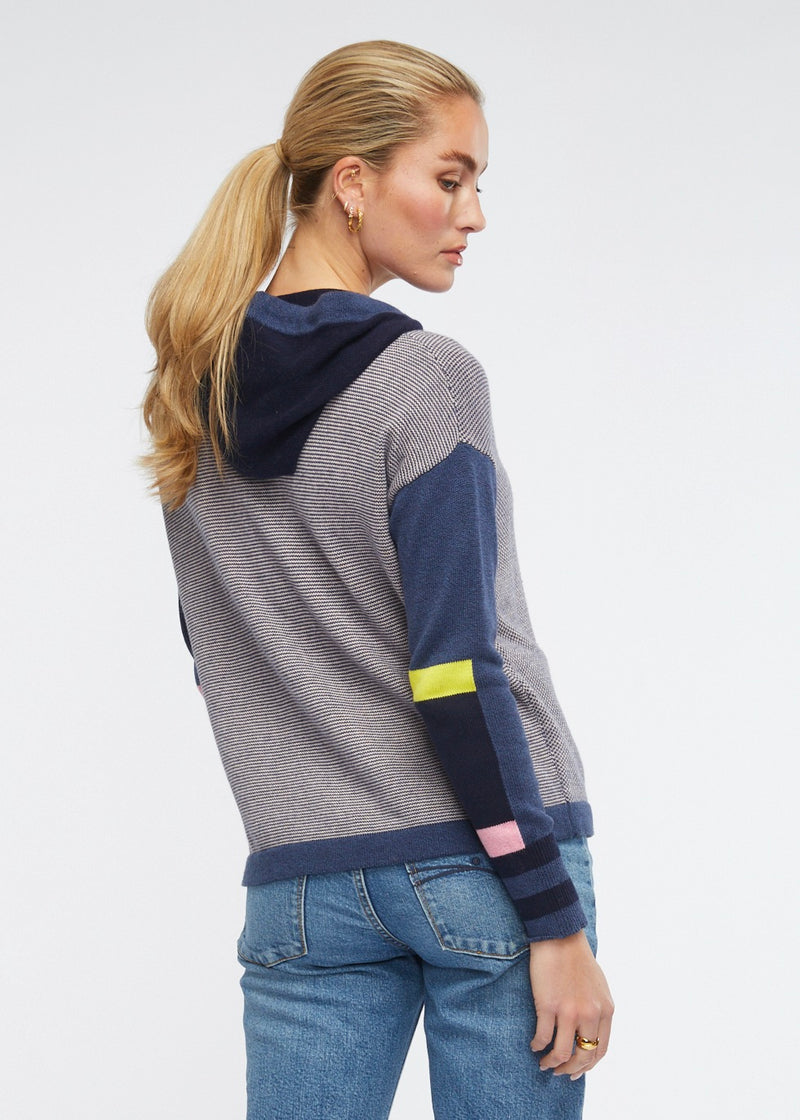 This gorgeous and handy little hoodie in denim combo features pink and yellow trims has a zip front, pockets and is knitted from cotton and cashmere. 