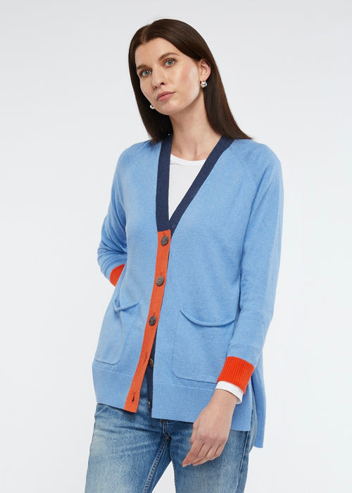 This cotton and cashmere cardi from Zaket & Plover in a chambray combo offers a beautiful blue with trims in dark denim and orange> Large pearly grey buttons are a feature as are the front pockets.