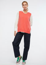 A simple round necked vest with side splits and knitted from a cotton and cashmere blend. Colour is dubarry.