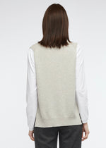A simple round necked vest with side splits and knitted from a cotton and cashmere blend. Colour is marl.