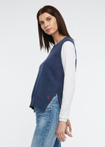 A simple round necked vest with side splits and knitted from a cotton and cashmere blend. Colour is denim.