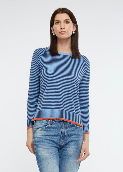 A must have in any wardrobe. Great to throw on with jeans for casual styling.  The chambray stripe is accentuated by vibrant orange in this knit of cotton and cashmere.