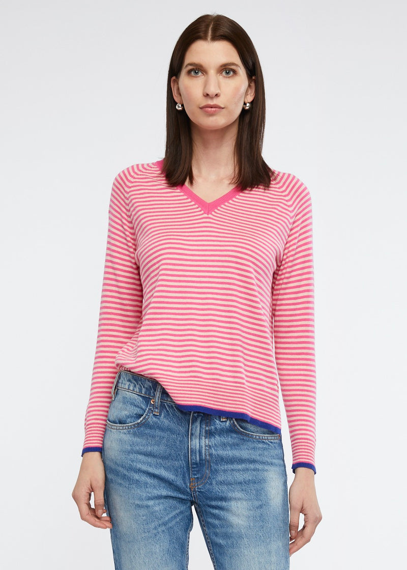 This light weight crew necked jumper is perfect for your casual winter wardrobe. The stripe of two toned pink is complimented by trims in a dark blue. Knitted from cotton and cashmere by Zaket & Plover.