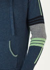  softly knitted hoodie of 5% cashmere and 95% cotton features a zipped front, pockets and feels beautiful to wear. The base colour is navy denim with a grey hood (that is edged with green stripes), Green and grey stripes and checks are features on the arms and also the back.