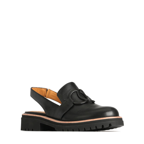 This casual sling back in a buffed black leather from EOS features a matt black metal trim, rounded toe, black rubber chunky sole with a tan rand.&nbsp;