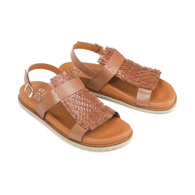 A good comfortable tan sandal is a staple in any wardrobe and this one fits that purpose perfectly. The sole is contoured and flat and the upper features two straps with a beautifully woven and fringed leather piece on top of the foot. Brand is EOS.