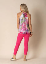 You can elevate your summer wardrobe with the Amberry silk Halter Neck Top,  this silk masterpiece boasts a unique washed floral print that captures the season's essence. Crafted for style and comfort, Amberry is a breathable delight in a feminine silhouette. Whether you're attending a garden party, summer soiree or romantic dinner, this top is fully lined in a viscose, which a naturally derived fabric that will assure you radiate elegance.

Material: Silk Outer, Lining Viscose which is derived from a natur