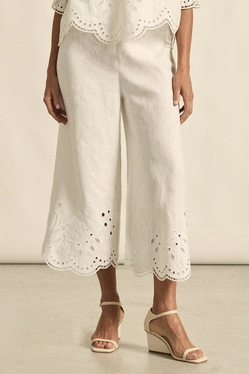 mbroidered with a delicate floral motif and finished with a scalloped hem, the apprise pant is a refined take on vacation dressing.&nbsp;

100% linen
bespoke embroidery with scalloped edge
cropped, wide-leg silhouette
high-waisted fit with side zip and clasp
elasticated back waistband for comfort
functional side pockets
designed to pair with the dawn top as a vacation-ready set