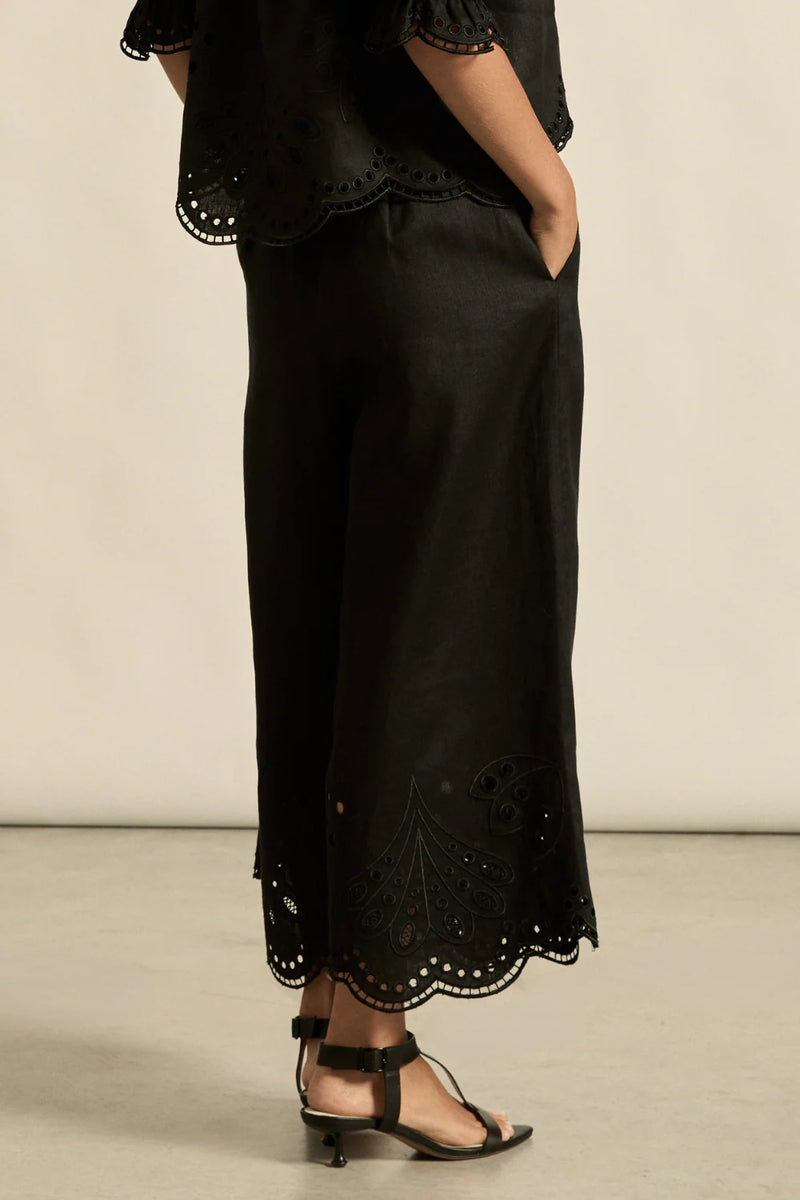 Embroidered with a delicate floral motif and finished with a scalloped hem, the apprise pant is a refined take on vacation dressing.&nbsp;

100% linen
bespoke embroidery with scalloped edge
cropped, wide-leg silhouette
high-waisted fit with side zip and clasp
elasticated back waistband for comfort
functional side pockets
designed to pair with the dawn top as a vacation-ready set