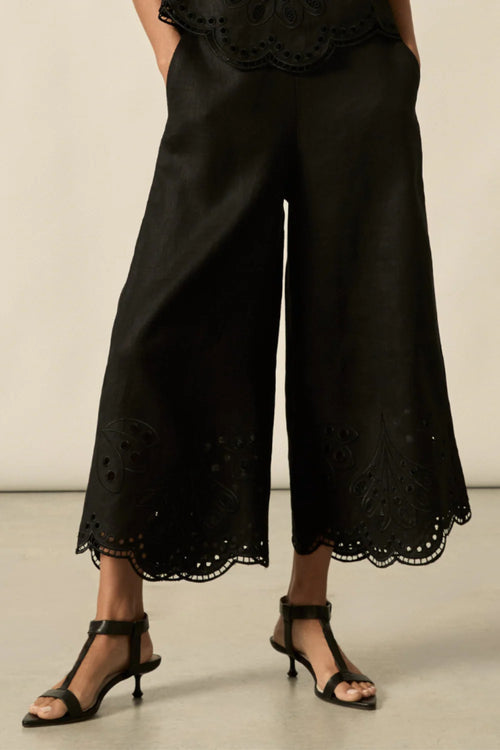 Embroidered with a delicate floral motif and finished with a scalloped hem, the apprise pant is a refined take on vacation dressing.&nbsp;

100% linen
bespoke embroidery with scalloped edge
cropped, wide-leg silhouette
high-waisted fit with side zip and clasp
elasticated back waistband for comfort
functional side pockets
designed to pair with the dawn top as a vacation-ready set