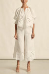 mbroidered with a delicate floral motif and finished with a scalloped hem, the apprise pant is a refined take on vacation dressing.&nbsp;

100% linen
bespoke embroidery with scalloped edge
cropped, wide-leg silhouette
high-waisted fit with side zip and clasp
elasticated back waistband for comfort
functional side pockets
designed to pair with the dawn top as a vacation-ready set
