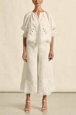 mbroidered with a delicate floral motif and finished with a scalloped hem, the apprise pant is a refined take on vacation dressing.&nbsp;

100% linen
bespoke embroidery with scalloped edge
cropped, wide-leg silhouette
high-waisted fit with side zip and clasp
elasticated back waistband for comfort
functional side pockets
designed to pair with the dawn top as a vacation-ready set