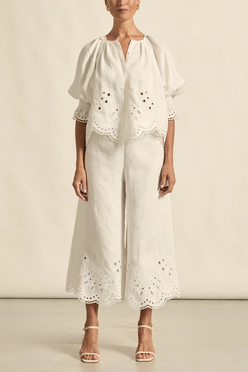 mbroidered with a delicate floral motif and finished with a scalloped hem, the apprise pant is a refined take on vacation dressing.&nbsp;

100% linen
bespoke embroidery with scalloped edge
cropped, wide-leg silhouette
high-waisted fit with side zip and clasp
elasticated back waistband for comfort
functional side pockets
designed to pair with the dawn top as a vacation-ready set