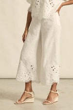 mbroidered with a delicate floral motif and finished with a scalloped hem, the apprise pant is a refined take on vacation dressing.&nbsp;

100% linen
bespoke embroidery with scalloped edge
cropped, wide-leg silhouette
high-waisted fit with side zip and clasp
elasticated back waistband for comfort
functional side pockets
designed to pair with the dawn top as a vacation-ready set