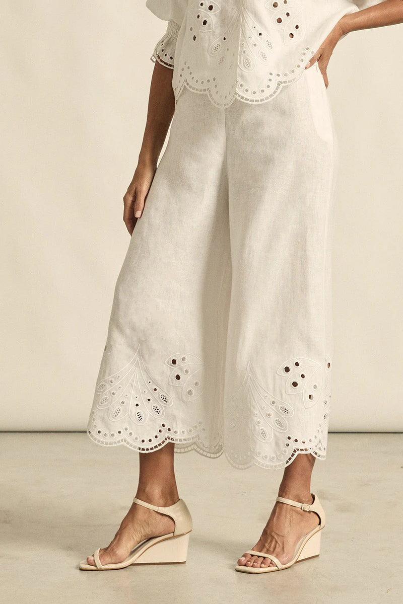 mbroidered with a delicate floral motif and finished with a scalloped hem, the apprise pant is a refined take on vacation dressing.&nbsp;

100% linen
bespoke embroidery with scalloped edge
cropped, wide-leg silhouette
high-waisted fit with side zip and clasp
elasticated back waistband for comfort
functional side pockets
designed to pair with the dawn top as a vacation-ready set