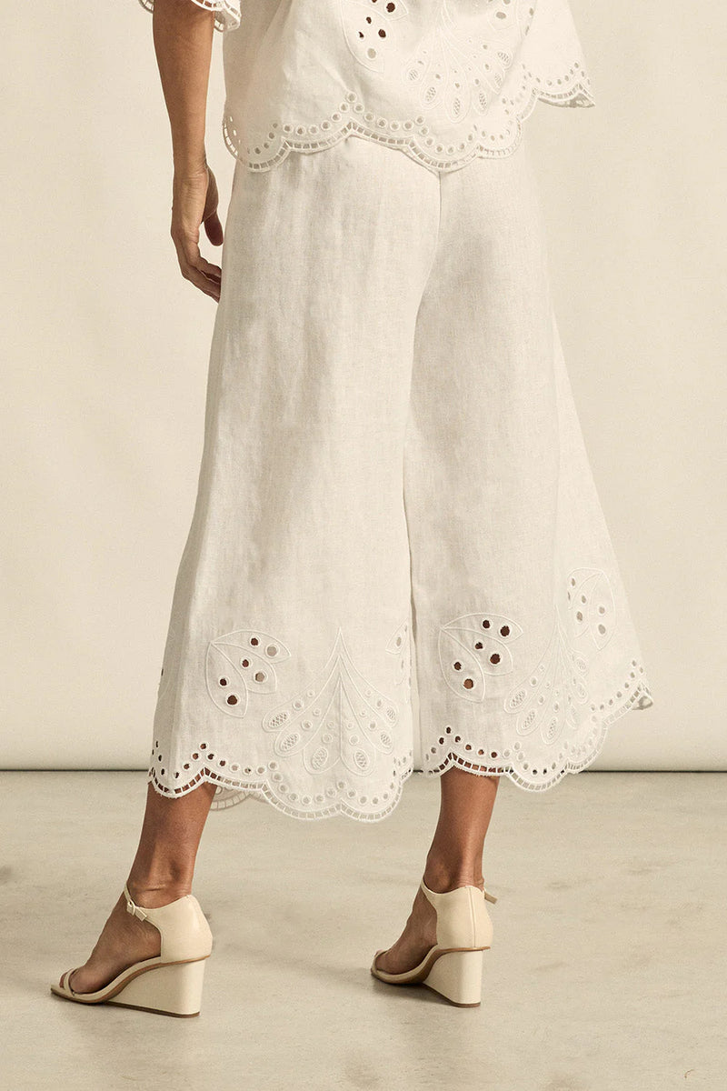 mbroidered with a delicate floral motif and finished with a scalloped hem, the apprise pant is a refined take on vacation dressing.&nbsp;

100% linen
bespoke embroidery with scalloped edge
cropped, wide-leg silhouette
high-waisted fit with side zip and clasp
elasticated back waistband for comfort
functional side pockets
designed to pair with the dawn top as a vacation-ready set